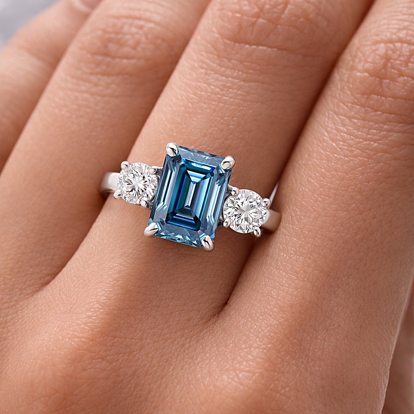 Side profile of 2.5ct blue cushion diamond ring on gold vermeil prongs