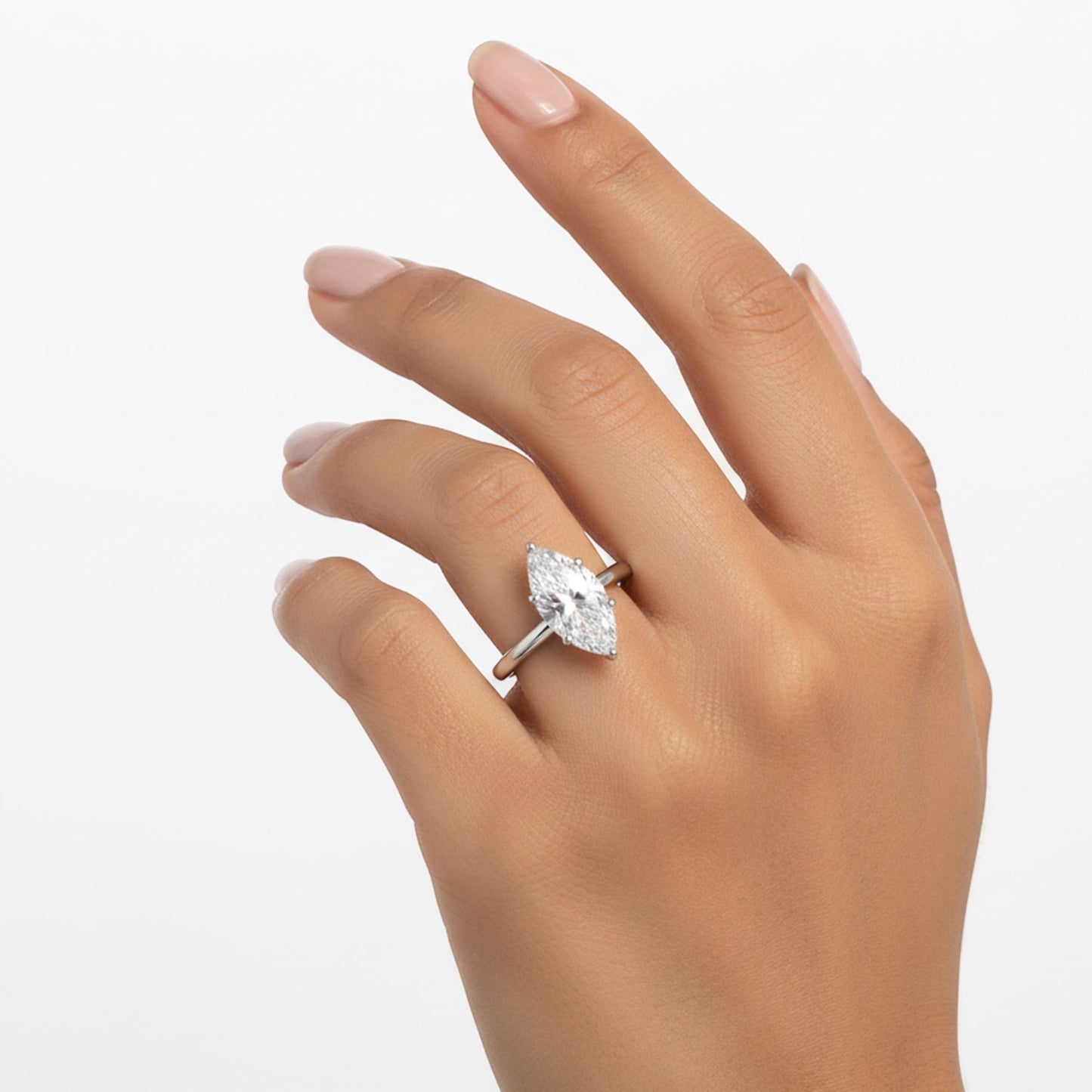 Side profile of 2ct marquise diamond ring with gold vermeil six-prong setting