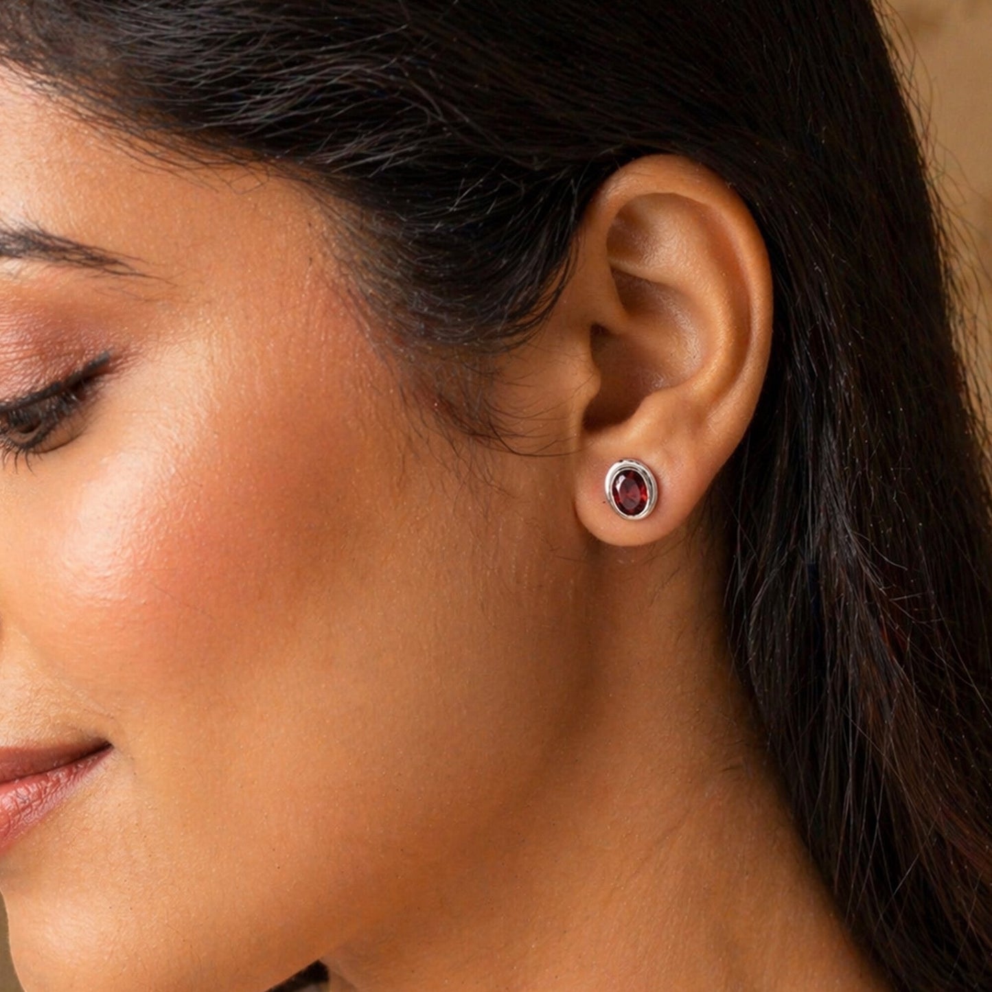 Pair of red garnet drop earrings, oval cut stones with deep wine colour