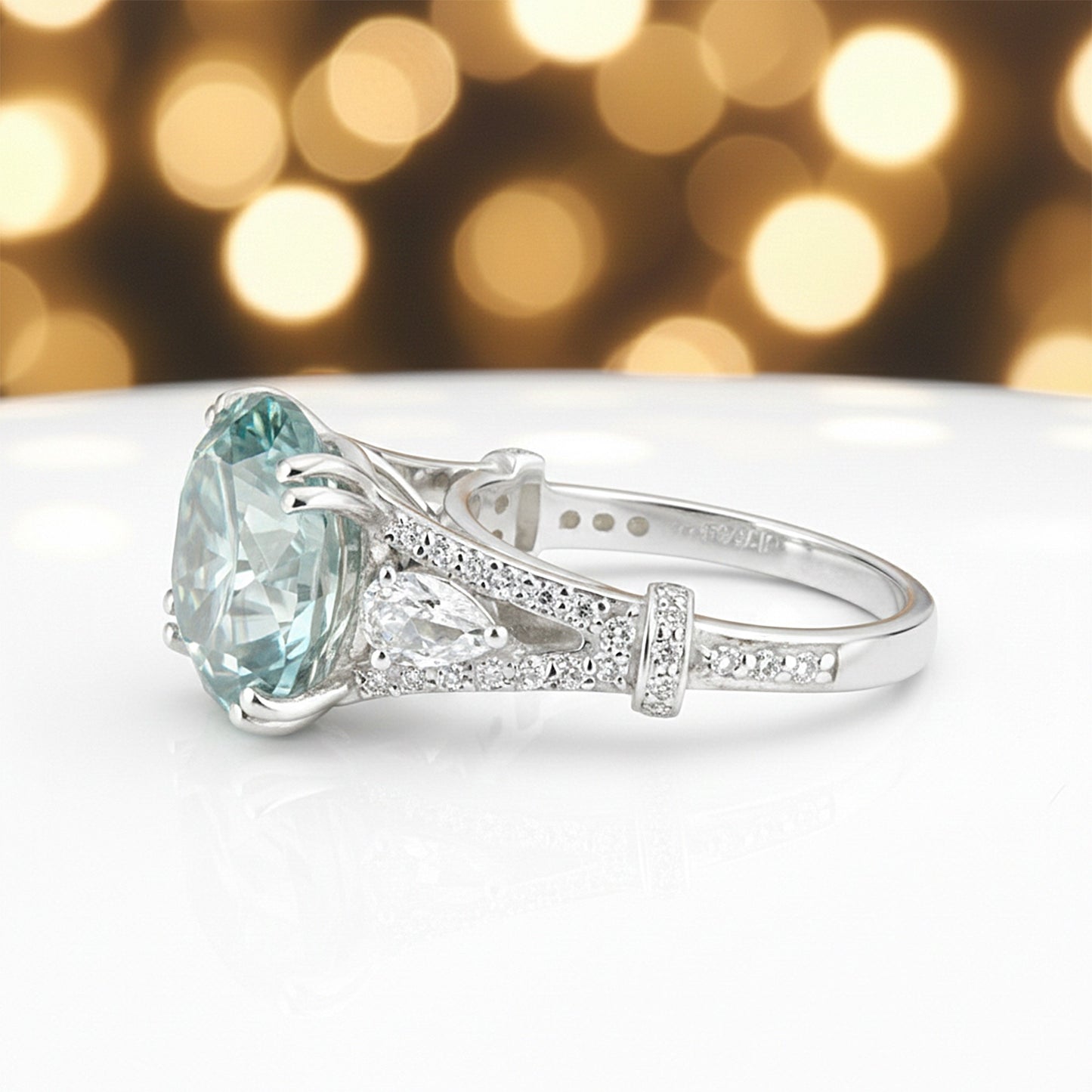 GEMHUB & CO. 5 Ct round cut blue lab grown diamond ring with pear-shaped accent stones in 18k gold vermeil.