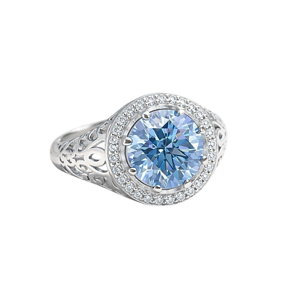 GEMHUB & CO. 3.50 Ct round cut blue lab-grown diamond ring with VS1 clarity, set in 18k gold vermeil with a halo of smaller diamonds.