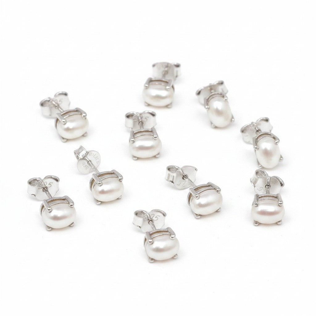 GEMHUB & CO. 5 pairs of white pearl stud earrings with 925 sterling silver settings. Natural, pear-cut pearls.