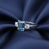 Inner band of 925 sterling silver with 18k gold vermeil exterior, blue cushion