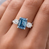 Side profile of 2.5ct blue cushion diamond ring on gold vermeil prongs