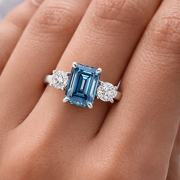 Side profile of 2.5ct blue cushion diamond ring on gold vermeil prongs