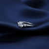 Fancy blue emerald cut lab diamond ring worn on hand, art deco styling