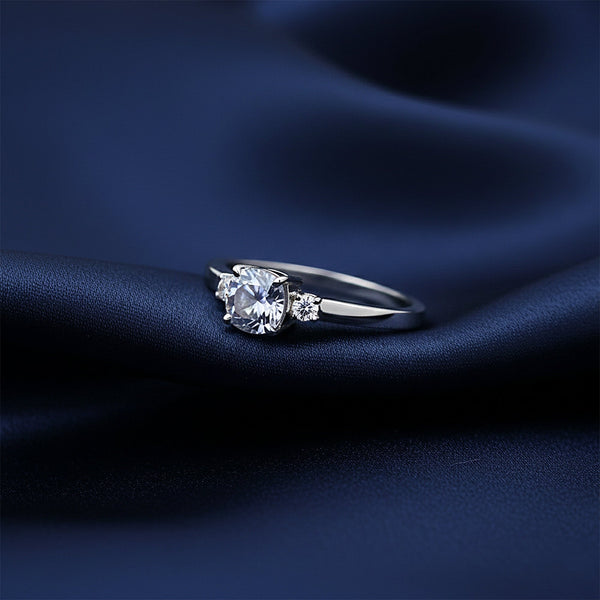 Fancy blue emerald cut lab diamond ring worn on hand, art deco styling