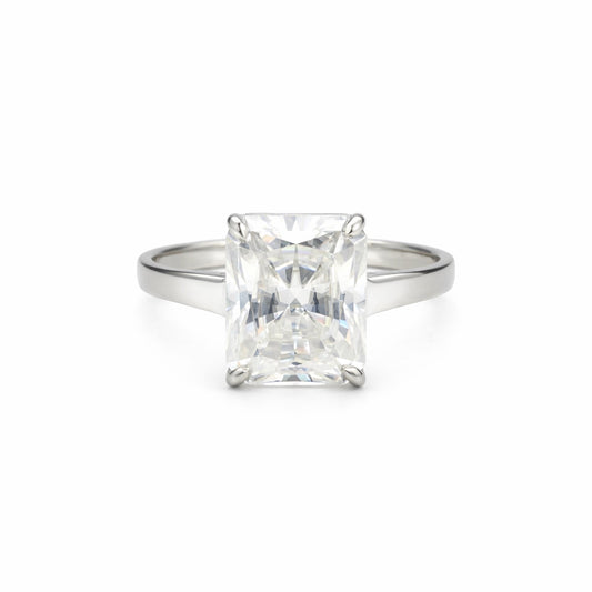 Emerald cut lab diamond ring worn on hand, art deco engagement styling
