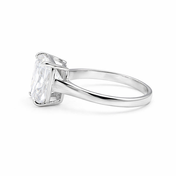 Side profile of 3 carat emerald diamond ring with gold vermeil east-west prongs