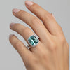 Side profile of fancy blue emerald diamond ring on gold vermeil east-west prongs