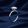 Round lab-grown diamond engagement ring worn on hand, VS1 clarity