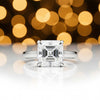 Detail of 18k gold vermeil prongs holding asscher cut lab diamond, top-down
