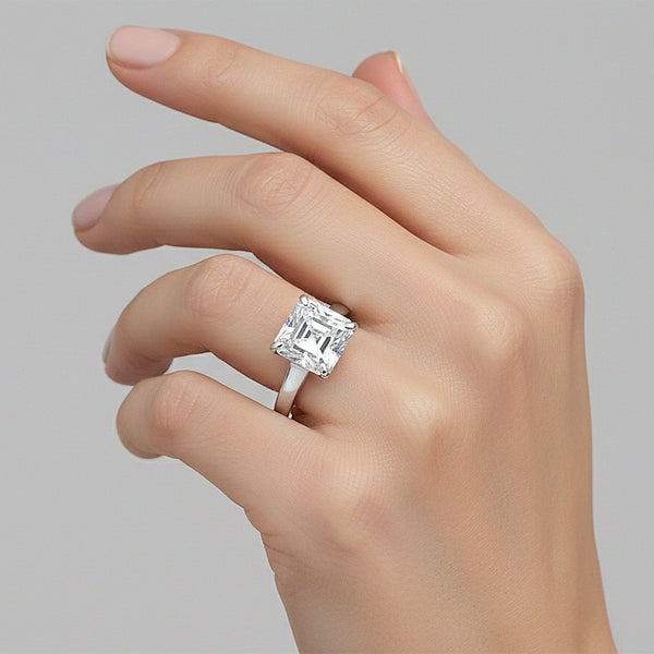 Asscher cut lab diamond ring worn on hand, art deco engagement styling