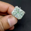 Moissanite solitaire ring on hand, demonstrating statement size and finger fit