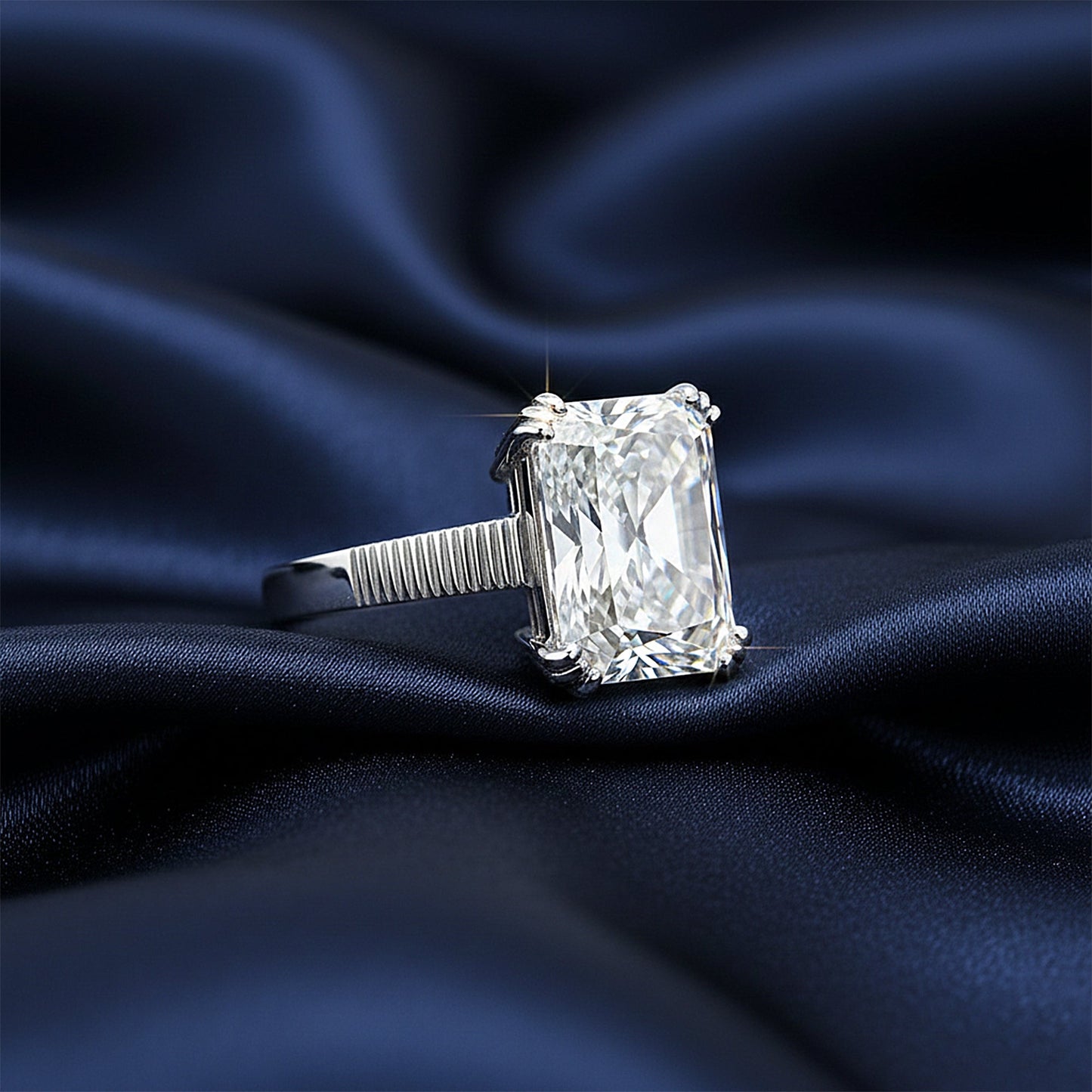 Detail of 18k gold vermeil four-prong setting holding 10ct emerald diamond