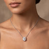 Model wearing 5.10 ct oval white moissanite solitaire pendant in gold vermeil 925 silver on a fine chain