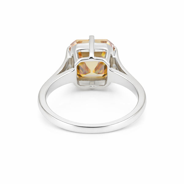 Detail of 18k gold vermeil prongs holding asscher diamond, top-down view