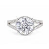 Close-up of round brilliant centre stone with pavé-set diamond accent stones