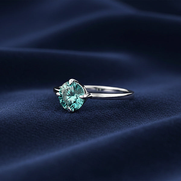 Top view of blue lab diamond showing ocean-blue saturation and round brilliance