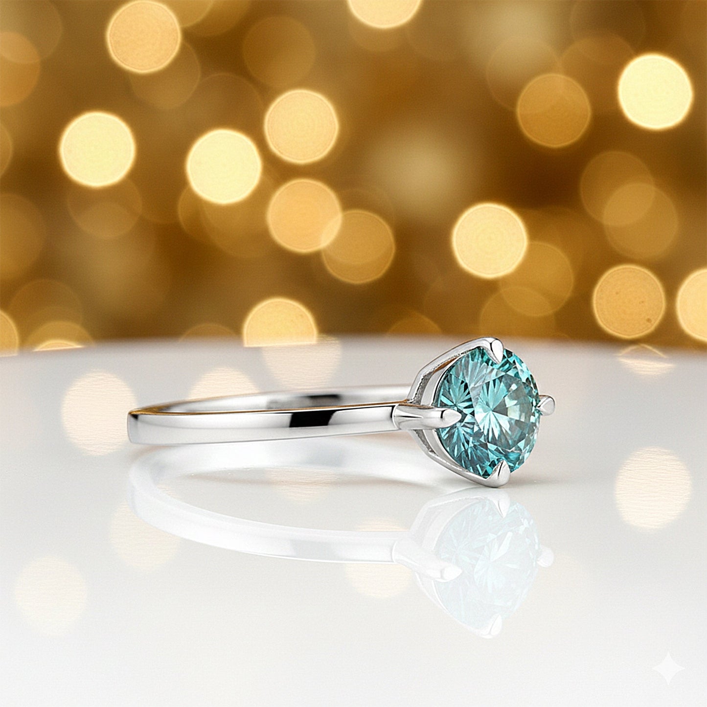 Detail of 18k gold vermeil setting with blue diamond, top-down vermeil finish