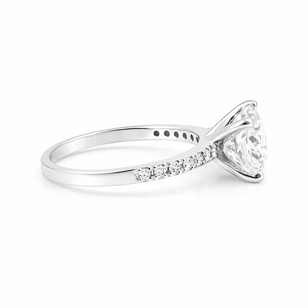 Cushion cut 3.2ct lab diamond ring worn on hand, vintage engagement styling