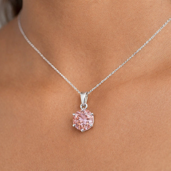 Round-cut pink lab diamond pendant with detailed view of 4-prong vermeil mounting