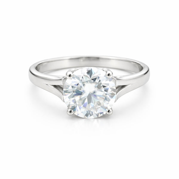 Side profile of round diamond solitaire with cathedral gold vermeil shoulders