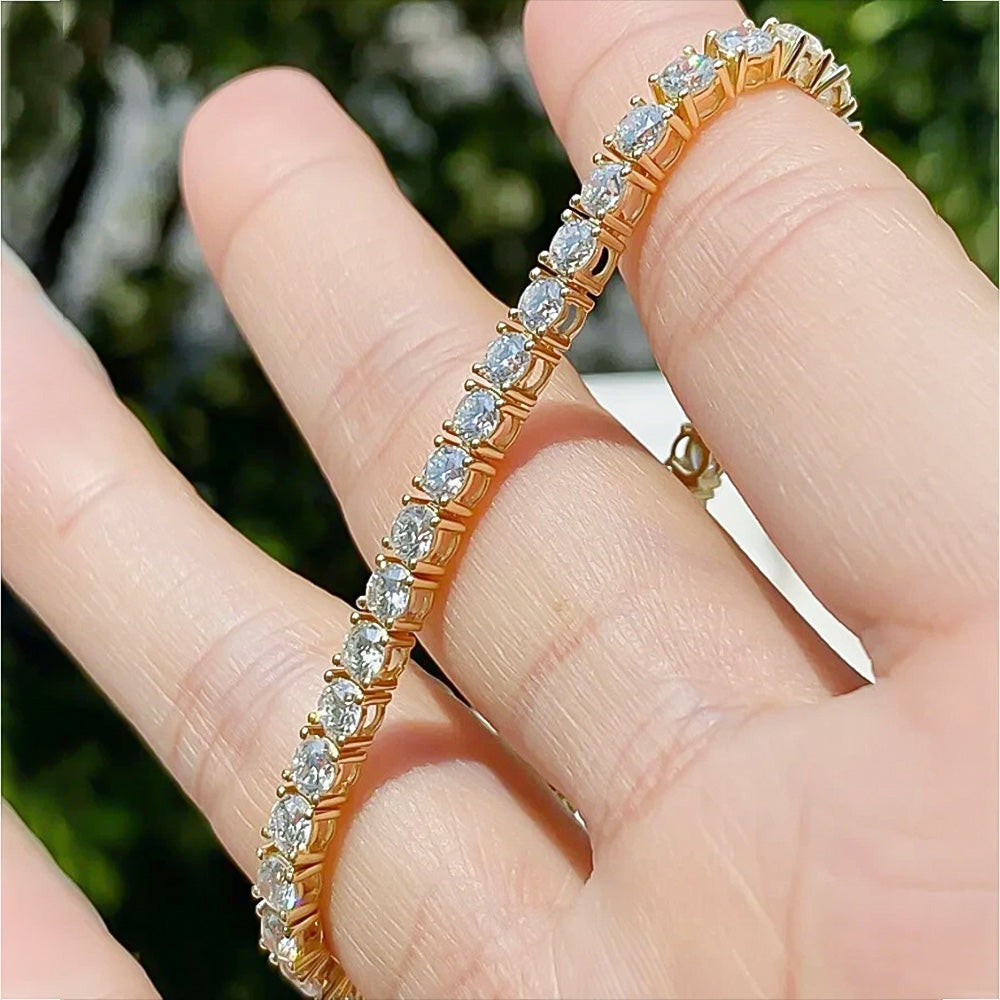 Detail of 14k yellow gold clasp and safety latch on diamond tennis bracelet