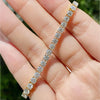 Diamond tennis bracelet laid flat showing full length and brilliance