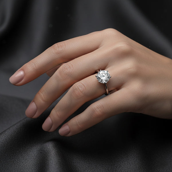 Side profile of round diamond solitaire with gold vermeil cathedral shoulders