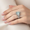 GEMHUB & CO. 5 Ct round cut blue lab grown diamond ring in 18k gold vermeil with pavé band and pear-shaped side stones.