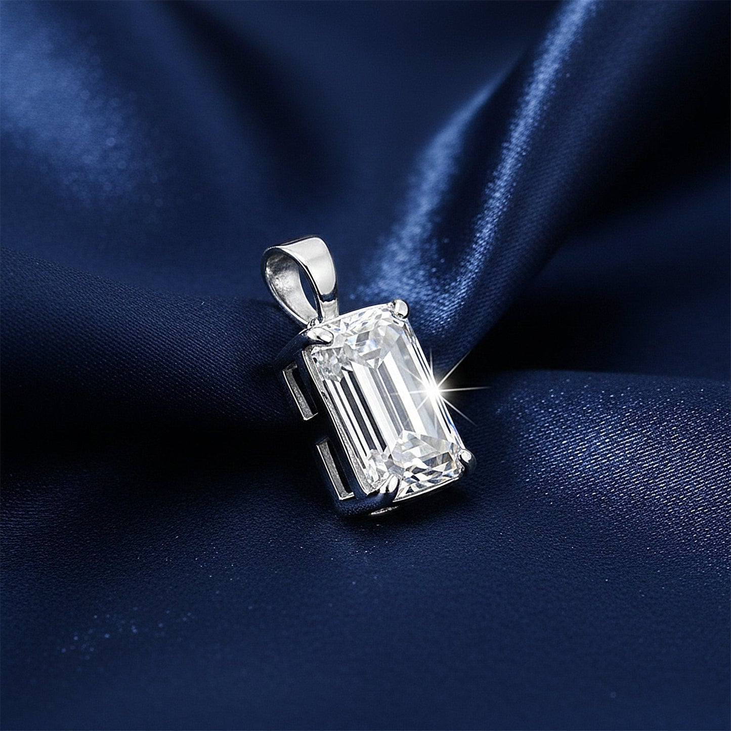 GEMHUB & CO. 3.30 Ct emerald cut lab grown diamond pendant, VS1 clarity, 18k gold vermeil setting on navy blue satin.