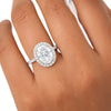 GEMHUB & CO. 3.00 Ct oval cut lab grown diamond ring with VS1 clarity, set in 18k gold vermeil with a halo of smaller diamonds.