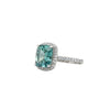 GEMHUB & CO. 5.00 Ct cushion cut blue lab grown diamond ring with VS1 clarity, set in 18k gold vermeil with a halo of small diamonds.