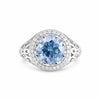 GEMHUB & CO. 3.50 Ct round cut blue lab-grown diamond ring with halo of small white stones, 18k gold vermeil band.