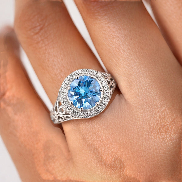 GEMHUB & CO. 3.50 Ct round cut blue lab grown diamond ring with halo and intricate filigree band, 18k gold vermeil.
