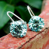 GEMHUB & CO. 6.20 Ct round blue moissanite dangler earrings in 18K gold vermeil over 925 sterling silver.