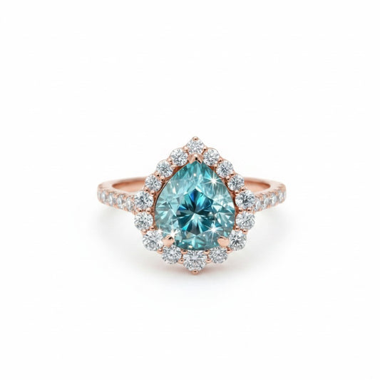 GEMHUB & CO. 4.70 Ct pear cut blue moissanite solitaire ring with halo, set in gold vermeil over sterling silver.