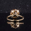 GEMHUB & CO. 10.50 Ct round cut champagne moissanite ring in gold vermeil with pavé band.