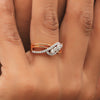 Criss-cross diamond ring worn on finger, modern stackable design