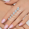 GEMHUB & CO. Marquise lab-created diamonds in sizes 0.7 to 3 Ct shown on a hand with pink nails.