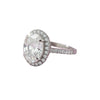 GEMHUB & CO. 3.00 Ct oval cut lab grown diamond ring with VS1 clarity, set in 18k gold vermeil with a halo of smaller diamonds.