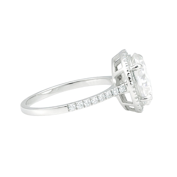 GEMHUB & CO. 3.00 Ct oval cut lab grown diamond ring with VS1 clarity in 18k gold vermeil. Halo setting with pavé band.