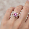 GEMHUB & CO. 2.5ct round pink moissanite solitaire ring with surrounding white accent stones in 18K gold plated sterling silver.
