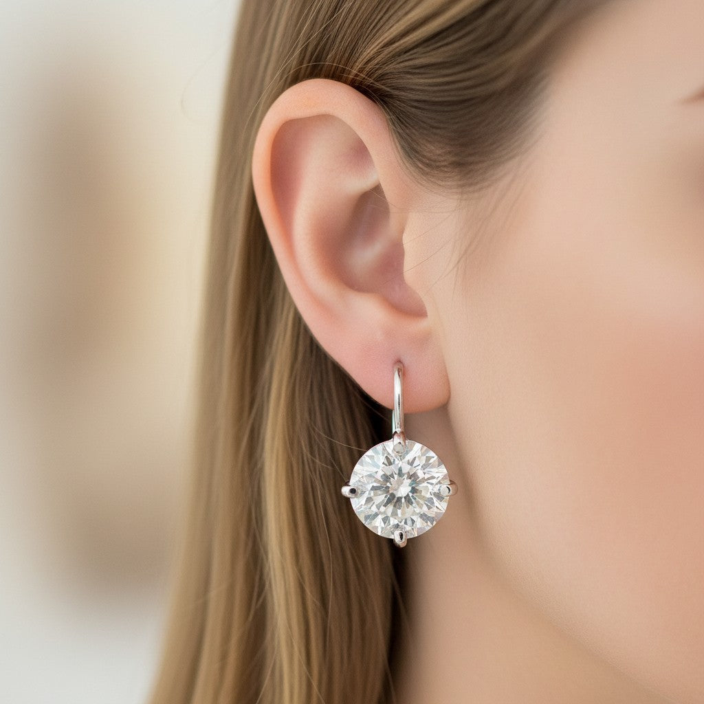 GEMHUB & CO. 5.00 Ct white moissanite solitaire dangler earrings in gold vermeil over sterling silver.
